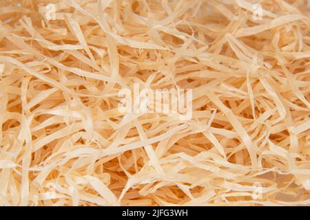 Wooden sawdust shavings natural texture background Stock Photo