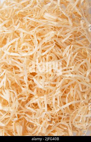 Wooden sawdust shavings natural texture background Stock Photo