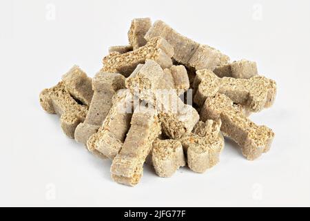 Small bones for dog. Dog snack. Foodie Puppies Flavor Bone Shaped Biscuits  for Dogs. Isolated on white background with shadow reflection. With clippin  Stock Photo - Alamy