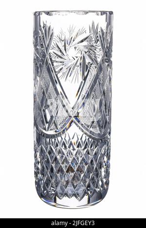 Crystal Empty glass Faceted Transparent Vase with carving pattern isolated on white background. Vintage item Use for flowers and interior decoration. Stock Photo