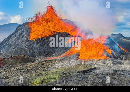 Volcanic eruption in Iceland. active volcano on the Reykjanes Peninsula. strong lava flow from a volcanic crater. liquid magma from crater at day in s Stock Photo