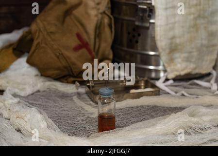 Vial with a vaccine for injection against the background of a medical hospital. Retro medecine Stock Photo