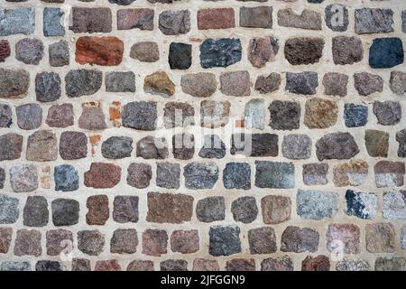 Background from a natural stone wall of an old building Stock Photo