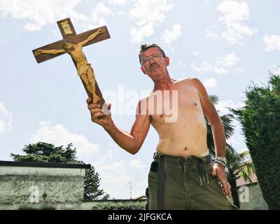 Italy, Milan province, Faithful Christian Stock Photo