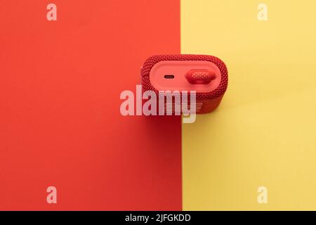 jerusalem-israel. 03-05-2021.  A small and portable speaker from the jbl company - model go3 in red - on a yellow red background Stock Photo