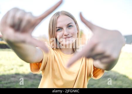 New year planning and vision concept. Close up of woman hands making frame gesture at camera Stock Photo