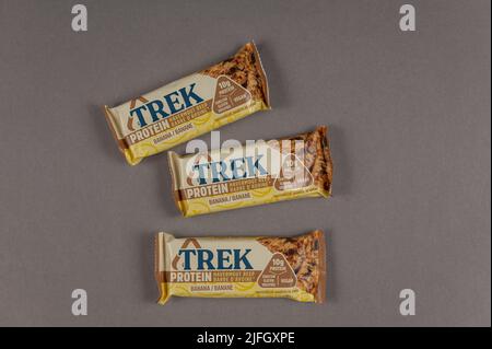 Three TREK Protein Energy Bars on Gray. A gluten-free, sugar-free snack. Products of the British company Natural Balance Foods. Healthy Foods. Ukraine Stock Photo