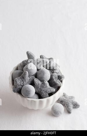 Salty liquorice salmiakki in Finnish in a white bowl with copy space Stock Photo