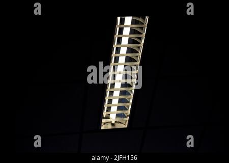 White light from Fluorescent light tube on the wall or Neon tube light.Copy space background for usage and any design. Stock Photo