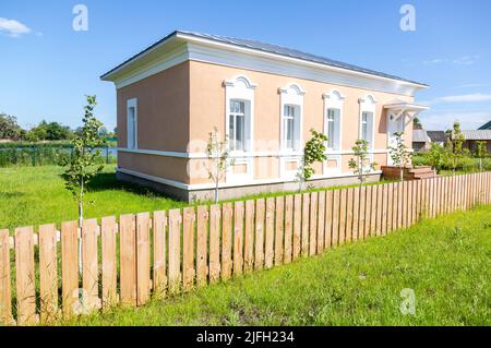 Samara, Russia - June 25, 2022: Ethnocultural complex 'People's Friendship Park'. Traditional jewish stone house with wooden fence Stock Photo