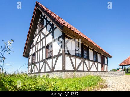 Samara, Russia - June 25, 2022: Ethnocultural complex 'People's Friendship Park'. Traditional german half-timbered house with ceramic roof Stock Photo