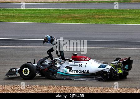 Silverstone, UK. 03rd July, 2022. George Russell (GBR) Mercedes AMG F1 W13 crashed at the start of the race, rushes to check the condition of Guanyu Zhou (CHN) Alfa Romeo F1 Team. 03.07.2022. Formula 1 World Championship, Rd 10, British Grand Prix, Silverstone, England, Race Day. Photo credit should read: XPB/Press Association Images. Credit: XPB Images Ltd/Alamy Live News Stock Photo