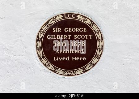 London, UK - May 19th 2022: A plaque in the Hampstead area of London, UK, marking where famous architect Sir George Gilbert Scott once lived. Stock Photo