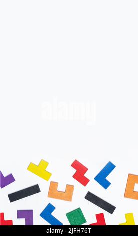 Scattered puzzle pieces on vertical banner with copy space. High quality photo Stock Photo