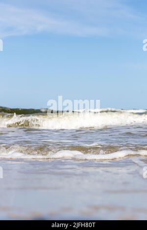 High and dangerous waves on the beach of Zempin on the island of Usedom on a beautiful day in summer Stock Photo