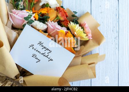 Happy Friendship Day Card With Mixed Flower Bouquet Stock Photo