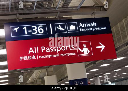 Passport Control sign airport. Sign to Passport Control, and Arrivals, Helsinki-Vantaa Airport ( Helsinki Airport ); Helsinki, Finland Europe Stock Photo