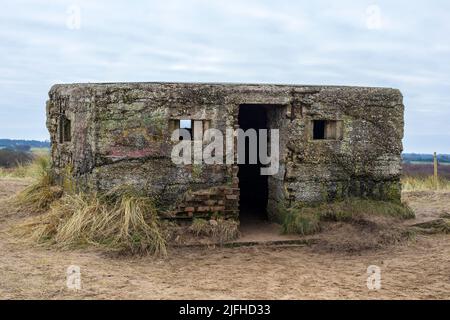 A derelict World War Two pillbox on the sand dunes in Horsey, Norfolk. Stock Photo