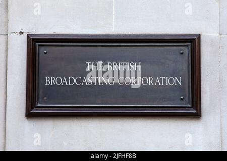 London, UK - March 8th 2022: The vintage sign on the exterior of Broadcasting House - the headquarters of the BBC, located on the corner of Portland P Stock Photo