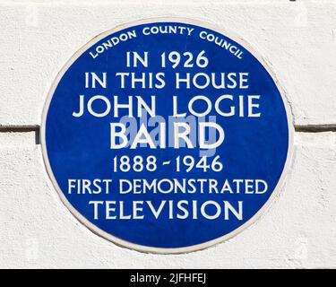 London, UK - March 8th 2022: A blue plaque located on Frith Street in Soho, London, UK, marking the location where in 1926, John Logie Baird first dem Stock Photo