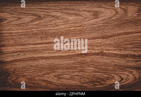 Brown scratched wooden cutting board, flat lay. Stock Photo