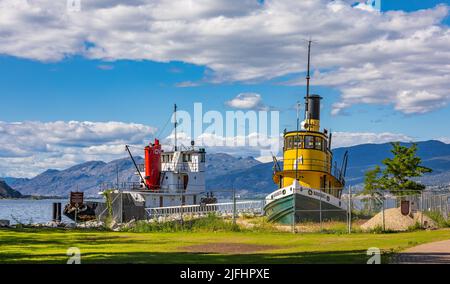 Boats and ships at the Sternwheeler SS Sicamous Heritage Park located at Okanagan Lake in Penticton British Columbia, Canada on summer sunny day-June Stock Photo