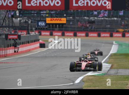Silverstone, UK. 3rd July 2022,  Silverstone Circuit, Silverstone, Northamptonshire, England: British F1 Grand Prix, Race day: Sergio Perez of Mexico driving the (11) Oracle Red Bull Racing RB18 leads the race into the first corner after the restart Credit: Action Plus Sports Images/Alamy Live News Stock Photo