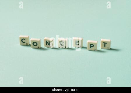 Concept formed of scrabble elements on turquoise background. Stock Photo