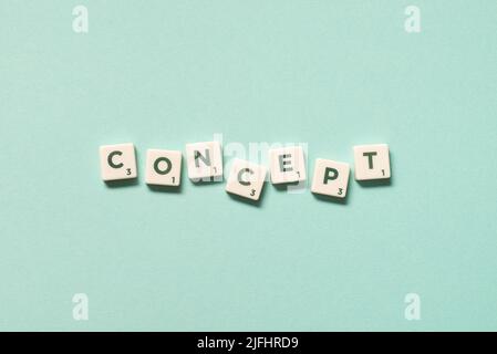 Concept formed of scrabble blocks on turquoise background. Stock Photo