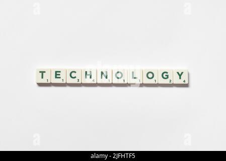 Technology formed of scrabble blocks on white background. Stock Photo