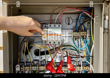 Consumer unit switchboard with fuse box circuit breakers. Stock Photo