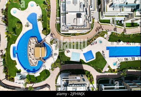 Modern complex swimming pools and residential building rooftop, aerial shot. Costa Blanca, province of Alicante. Spain. Travel and summertime vacation Stock Photo