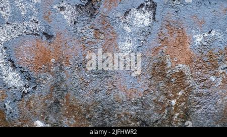 Old faded blue concrete wall in Bali, Indonesia. Patches of white paint and dirt, wallpaper and background texture Stock Photo