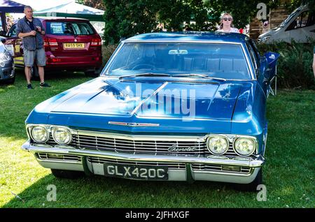 Front view of a 1960s Chevrolet Impala 327 in blue at The Berkshire Car show in Reading, UK Stock Photo