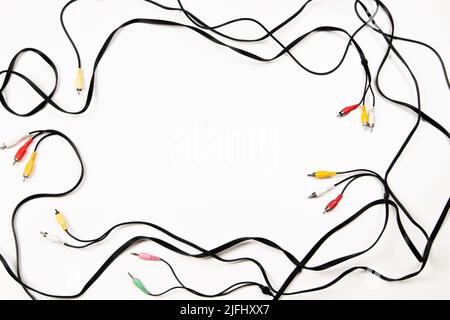 Audio video cables and plugs frame on white background. Top view, copy space Stock Photo