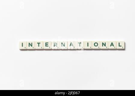 International formed of scrabble blocks on white background. Stock Photo