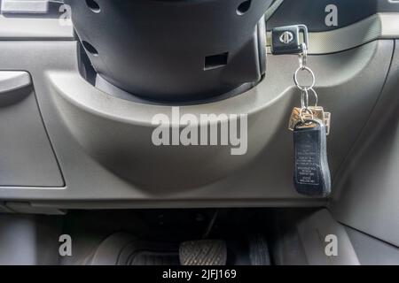 Toronto, Canada, August 2021 - Car ignition key inside lock, viewed from a low angle Stock Photo