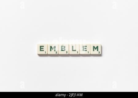 Emblem formed of scrabble tiles on white background. Stock Photo
