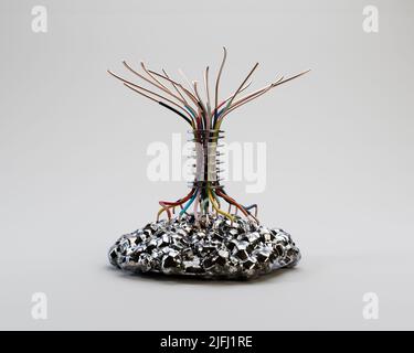 A concept industrial tree made out of electrical wires and mechanical components mounted on a metal base - 3D render Stock Photo