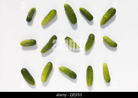 cucumbers with shadow lie on a white background Stock Photo