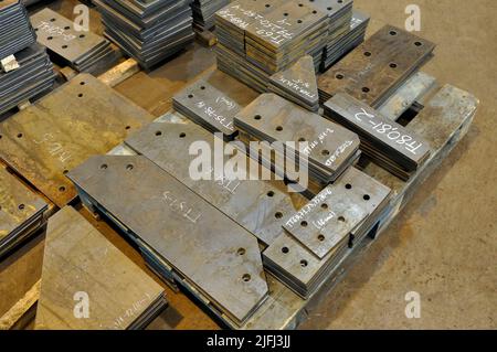 Metal cutting. Warehousing of finished parts with marking. Stock Photo