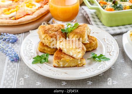 Traditional croquettes stuffed with eggs. Party dish Stock Photo