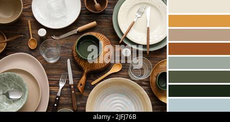 Many tableware on wooden background. Different color patterns Stock Photo