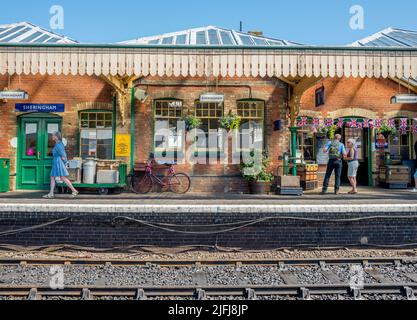 Passengers and tourist on the platform at the historic railway station at Sheringham which is part of the North Norfolk railway. Stock Photo