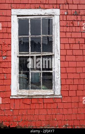 A window on the side of an old barn Stock Photo
