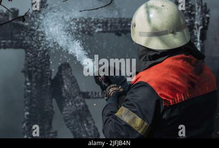 Brave firefighter saving burning building. Firefighter work concept ...