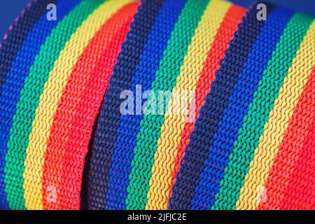 Colorful abstract background, rolled rainbow ribbons close up Stock Photo