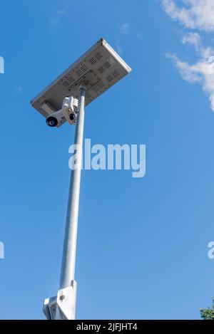 A solar powered security surveillance camera on a building site in Sydney, New South Wales, Australia Stock Photo