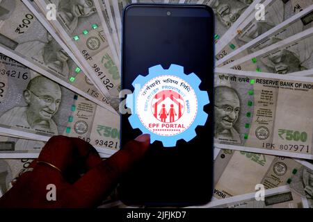 India. 03rd July, 2022. In this photo illustration, an Employees Provident fund (EPF) account logo seen on a smartphone with Indian Currency note illustrations on the background. (Photo by Avishek Das/SOPA Images/Sipa USA) Credit: Sipa USA/Alamy Live News Stock Photo