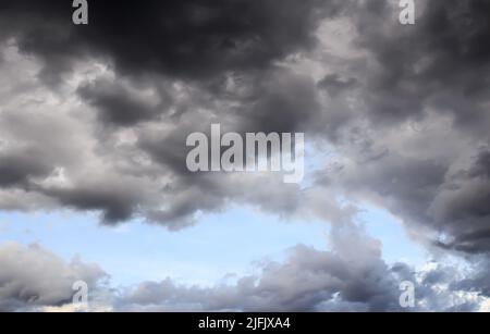 Dark storm clouds before rain, with strange cloud shapes Stock Photo